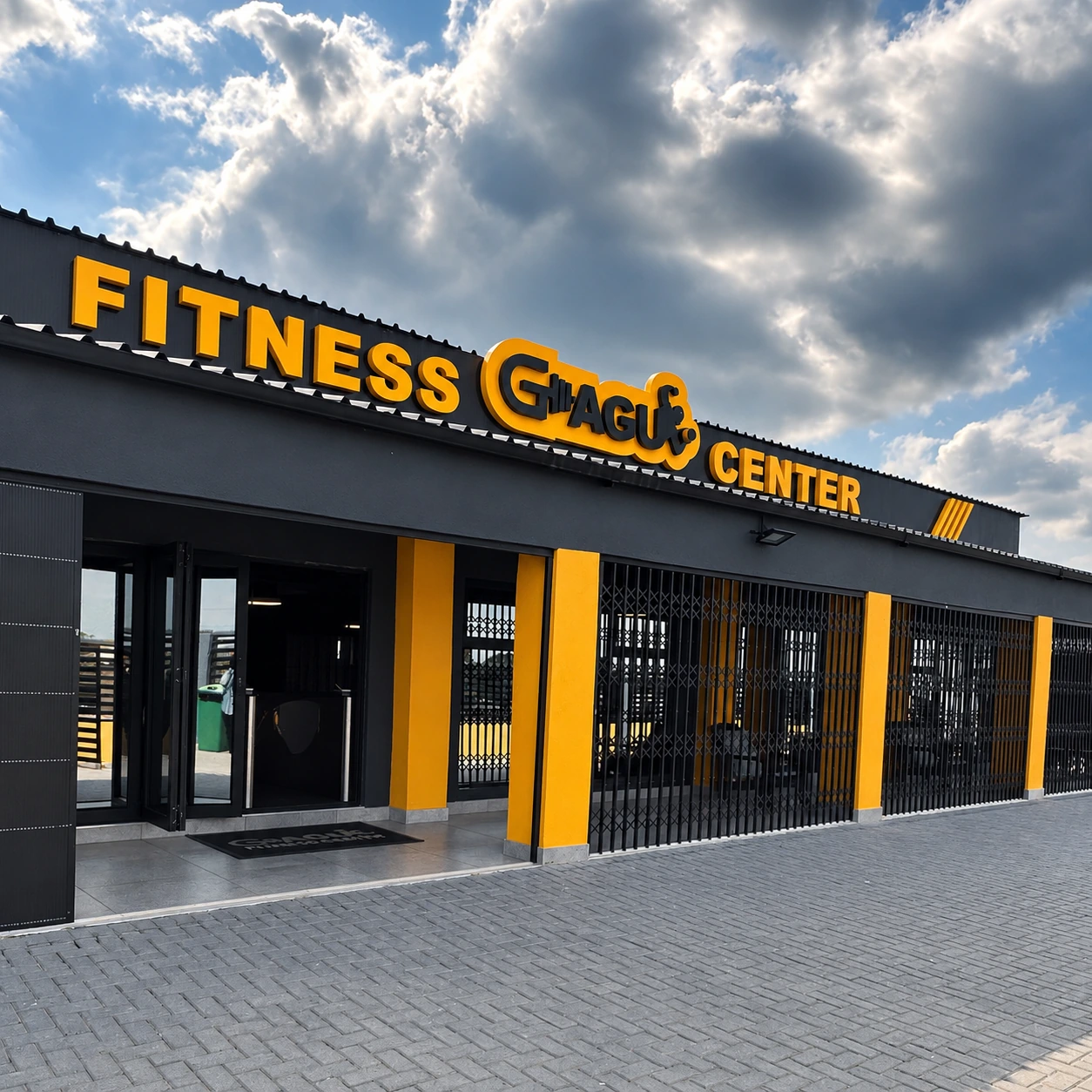 Gagu Fitness Center’s black and yellow exterior in Mzinti